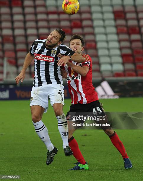 Josh Robson of Sunderland competes with Alan Smith of Notts County during the Checkatrade Trophy group stage match between Sunderland and Notts...