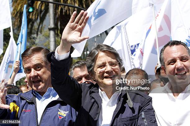 Ecuadorean presidential candidate Guillermo Lasso gives the thumbs up during a walk in Quito on November 9, 2016. Lasso registered his candidacy for...