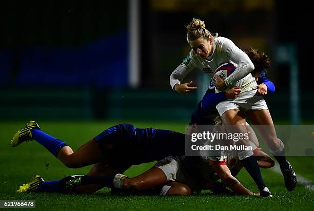 Fiona Pocock of England is tackled by Camille Grassineau of France during the Old Mutual Wealth Series match between England Women and France Women...