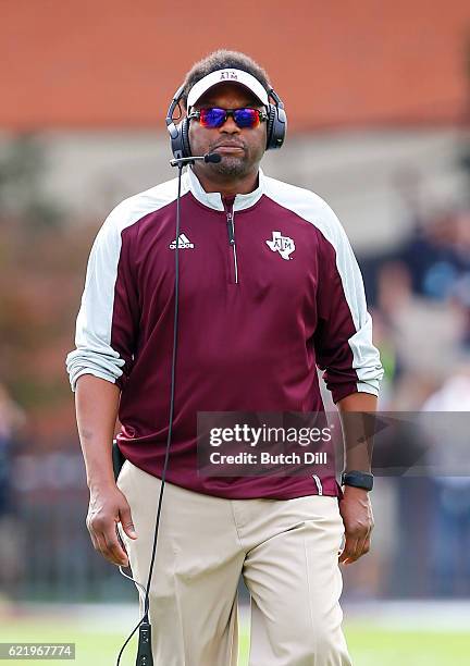 Head coach Kevin Sumlin of the Texas A&M Aggies walks the sideline during the first half of an NCAA college football game against the Mississippi...