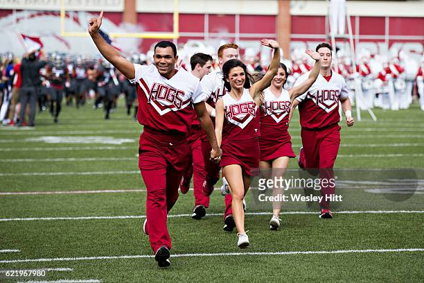 Arkansas Razorback cheerleaders run onto the field before a game against the Florida Gators at Razorback Stadium on November 5, 2016 in Fayetteville,...