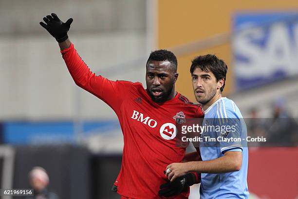 November 06: Jozy Altidore of Toronto FC jostles for position with Andoni Iraola of New York City FC during the NYCFC Vs Toronto FC MLS playoff game...