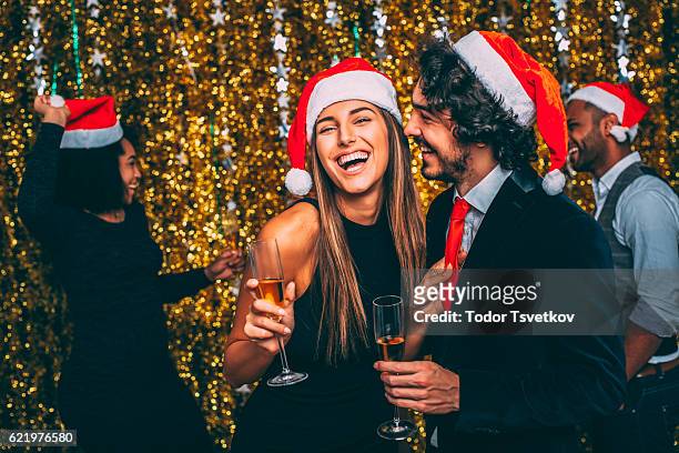 christmas party - flirting stockfoto's en -beelden