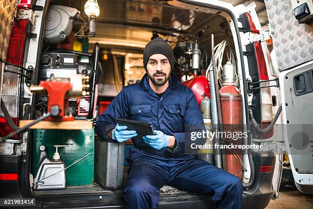 mechanic technician on a garage - electrical engineer stock pictures, royalty-free photos & images