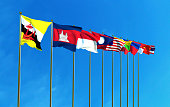 Asean Economic Community flags on the blue sky background.