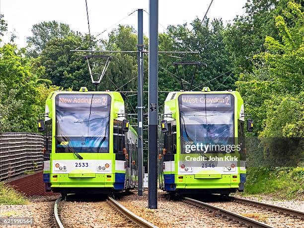 tramlink trams pass near the junction at sandilands - lightrail stock pictures, royalty-free photos & images