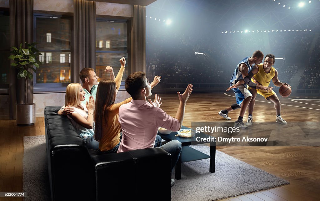 Students watching very realistic Basketball game at home
