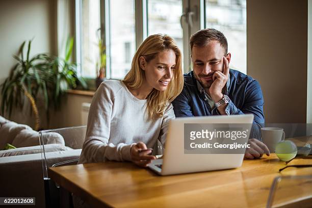 enjoying internet time - couple bildbanksfoton och bilder