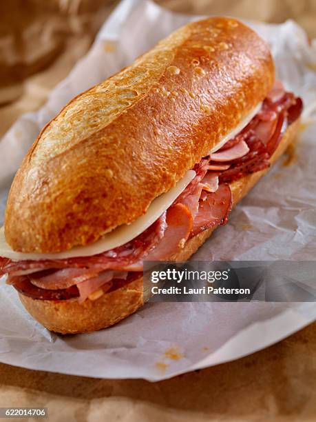 italian sandwich with salami,genoa, prosciutto and provolone - submarine sandwich imagens e fotografias de stock