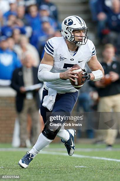 Taysom Hill of the BYU Cougars scrambles with the ball during the game against the Cincinnati Bearcats at Nippert Stadium on November 5, 2016 in...