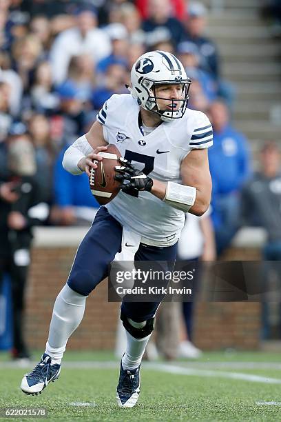 Taysom Hill of the BYU Cougars scrambles with the ball during the game against the Cincinnati Bearcats at Nippert Stadium on November 5, 2016 in...