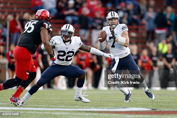 Taysom Hill of the BYU Cougars scrambles with the ball during the game against the Cincinnati Bearcats at Nippert Stadium on November 5, 2016 in...