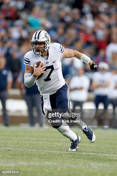 Taysom Hill of the BYU Cougars scrambles with the ball during the game against the Cincinnati Bearcats at Nippert Stadium on November 5, 2016 in...