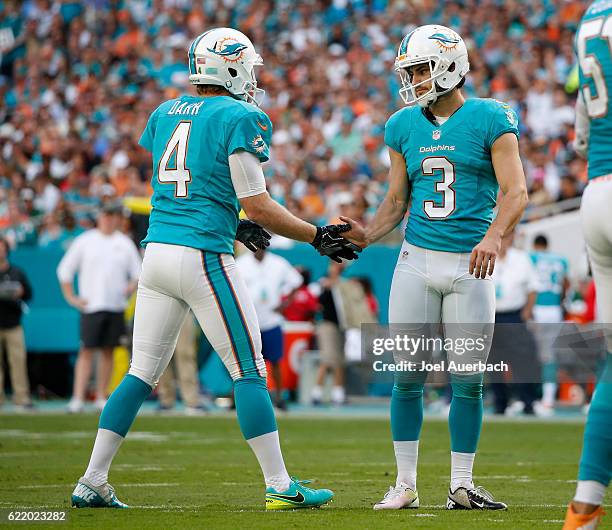 Andrew Franks is congratulated by Matt Darr of the Miami Dolphins after kicking a field goal against the New York Jets on November 6, 2016 at Hard...