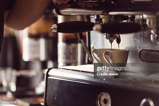coffee machine makes two cup hot coffee - dirty lettuce stock pictures, royalty-free photos & images