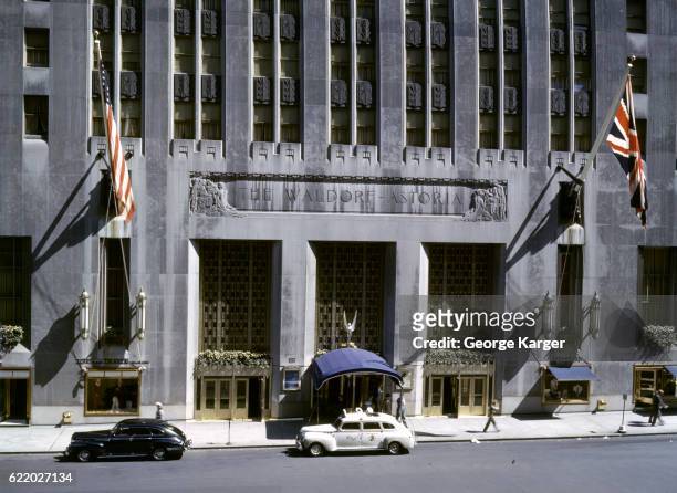 Exterior view of the front entrance of the Waldorf Astoria Hotel, New York, New York, 1941.