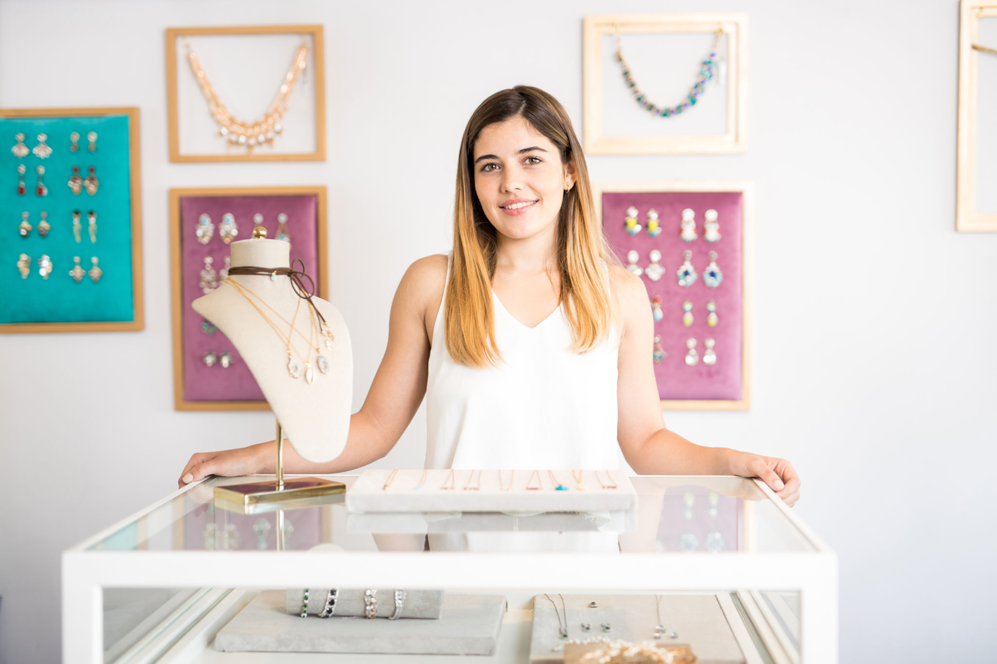 Pretty Hispanic woman owns a jewelry Pretty Hispanic woman owns a jewelry