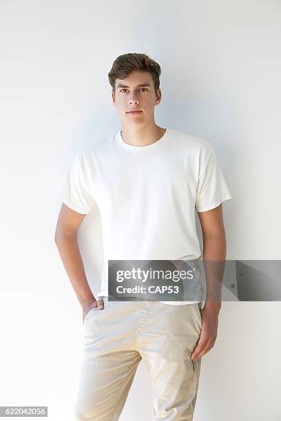 portrait of a young man wearing white t-shirt - t shirt stock pictures, royalty-free photos & images