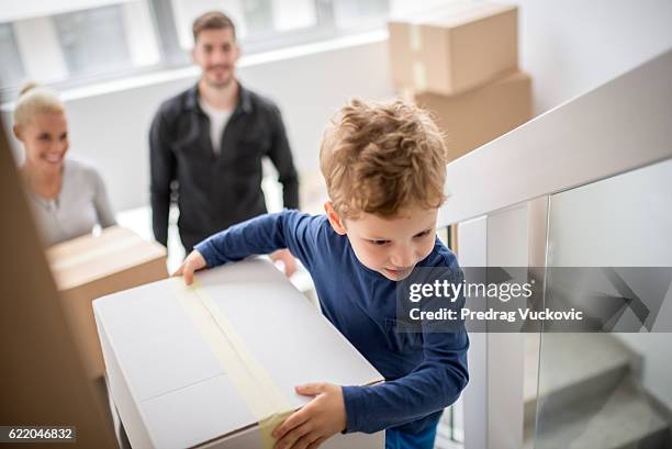 family moving into new building - staircase house stock pictures, royalty-free photos & images