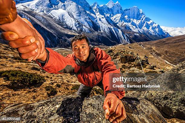 nepali "everest sherpa" climbing in himalayas - sherpa nepal stock pictures, royalty-free photos & images