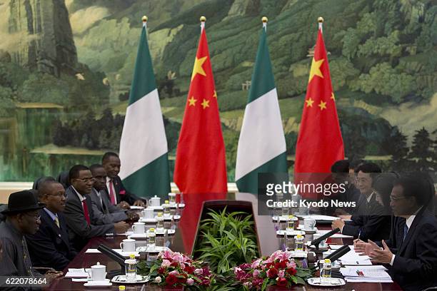 Beijing, China - File photo shows Nigerian President Goodluck Jonathan holding talks with Chinese Premier Li Keqiang in the Great Hall of the People...