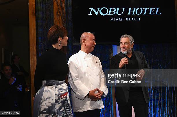 Of Nobu Hotel Miami Beach Laurence Dubey, chef Nobu Matsuhisa and actor Robert DeNiro speak onstage during the Nobu Hotel Miami Beach launch VIP...