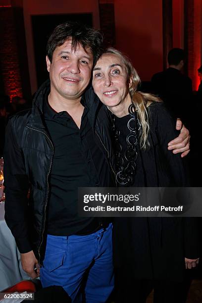 Artist Adel Abdessemed and Carla Sozzani attend the Carla Sozzani : Photo Exhibition at Azzedine Alaia Gallery on November 9, 2016 in Paris, France.