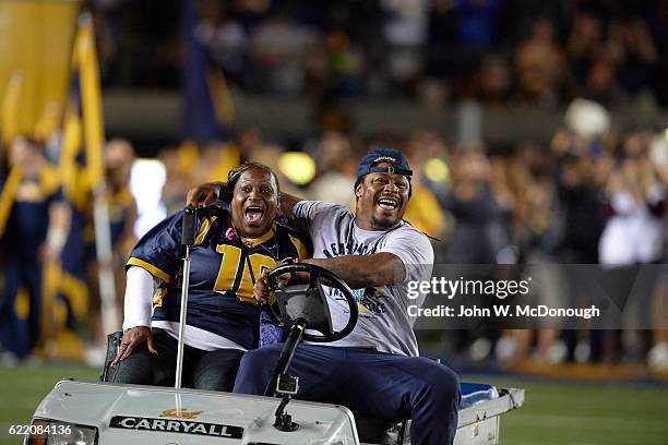 Former California running back Marshawn Lynch with his mother Delisa driving a golf cart on field and leading California players onto field before...