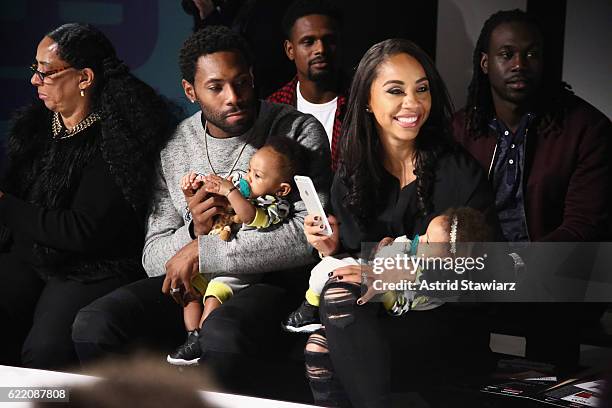 Football player Antonio Cromartie and Terricka Cromartie watch the runway show during BKLYN Rocks presented by City Point, Kids Foot Locker, and...