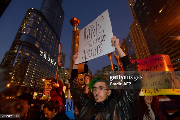 People take part in a protest near the Trump tower, against President-elect Donald Trump, in Chicago, Illinois on November 9, 2016.