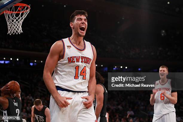 Willy Hernangomez of the New York Knicks reacts after a foul against the Brooklyn Nets during the second half at Madison Square Garden on November 9,...