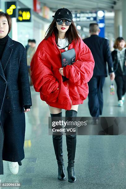 Actress Yang Mi arrives at the Beijing Capital International Airport on November 9, 2016 in Beijing, China.