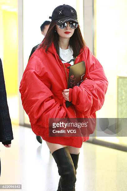 Actress Yang Mi arrives at the Beijing Capital International Airport on November 9, 2016 in Beijing, China.