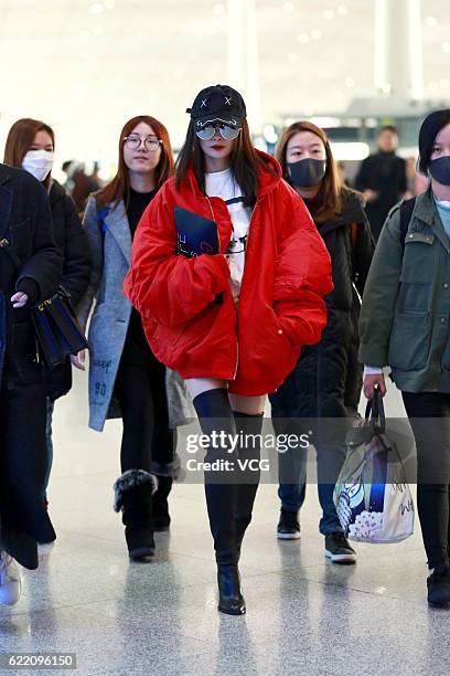 Actress Yang Mi arrives at the Beijing Capital International Airport on November 9, 2016 in Beijing, China.