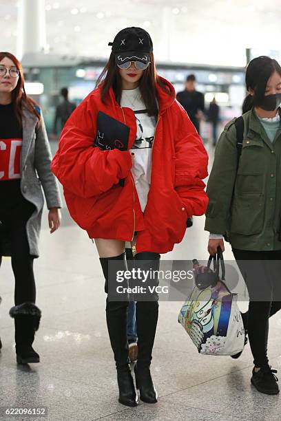 Actress Yang Mi arrives at the Beijing Capital International Airport on November 9, 2016 in Beijing, China.