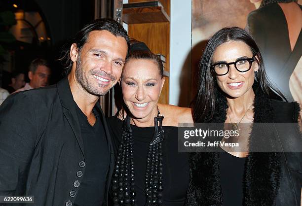 Gianpaolo DeFelice, fashion designer Donna Karan and actress Demi Moore attend the Urban Zen LA Opening on November 9, 2016 in Los Angeles,...