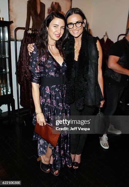 Actresses Shiva Rose and Demi Moore attend the Urban Zen LA Opening on November 9, 2016 in Los Angeles, California.