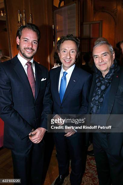 Prince Felix de Luxembourg, Stephane Bern and French Academician Dominique Perrault attend Stephane Bern signs his Book "Mon Luxembourg" at Residence...