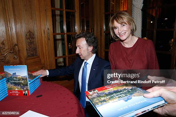 Stephane Bern and Eve Ruggieri attend Stephane Bern signs his Book "Mon Luxembourg" at Residence of the Ambassador of Luxembourg on November 9, 2016...