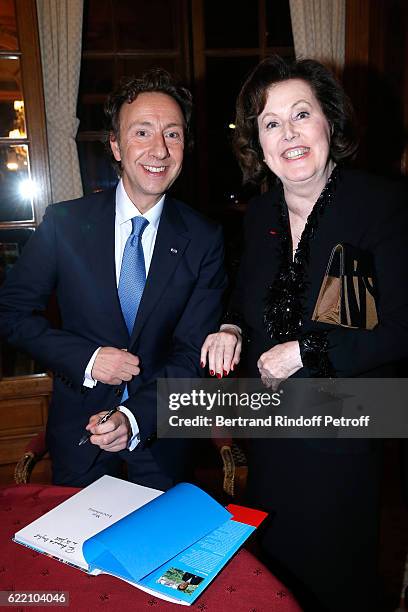 Stephane Bern and Laure de Beauvau Craon attend Stephane Bern signs his Book "Mon Luxembourg" at Residence of the Ambassador of Luxembourg on...