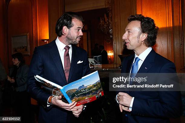 Prince Felix de Luxembourg and Stephane Bern attend Stephane Bern signs his Book "Mon Luxembourg" at Residence of the Ambassador of Luxembourg on...