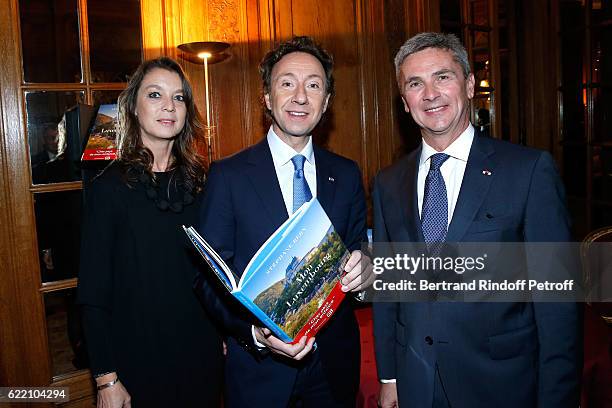 Isabelle Faber, Stephane Bern and Ambassador of Luxembourg to France, Paul Duhr attend Stephane Bern signs his Book "Mon Luxembourg" at Residence of...