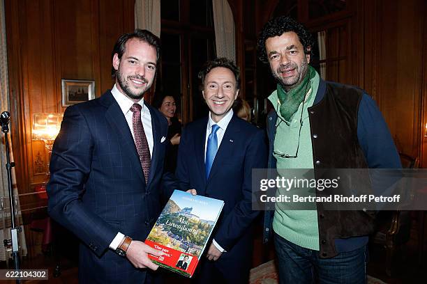 Prince Felix de Luxembourg, Stephane Bern and Photographer for the book, Guillaume de Laubier attend Stephane Bern signs his Book "Mon Luxembourg" at...