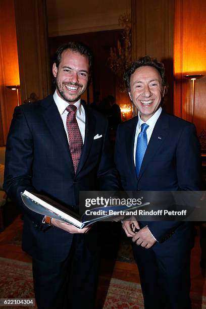 Prince Felix de Luxembourg and Stephane Bern attend Stephane Bern signs his Book "Mon Luxembourg" at Residence of the Ambassador of Luxembourg on...