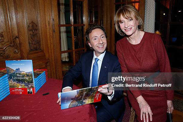 Stephane Bern and Eve Ruggieri attend Stephane Bern signs his Book "Mon Luxembourg" at Residence of the Ambassador of Luxembourg on November 9, 2016...