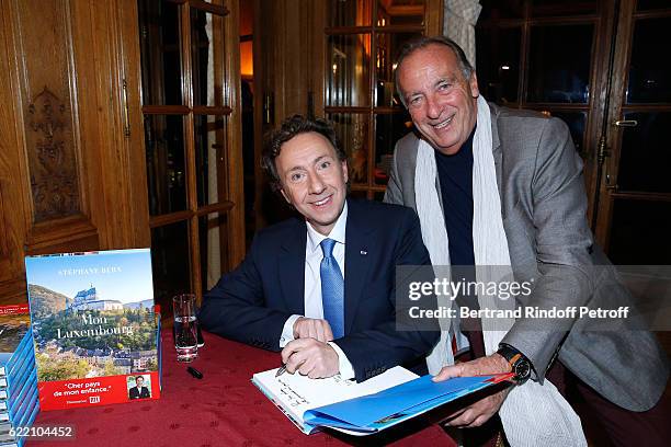 Stephane Bern and humorist Yves Lecoq attend Stephane Bern signs his Book "Mon Luxembourg" at Residence of the Ambassador of Luxembourg on November...