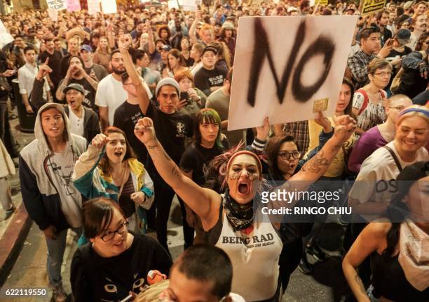Demonstrators gather to protest a day after President-elect Donald Trump's victory, at a rally outside Los Angeles City Hall in Los Angeles,...