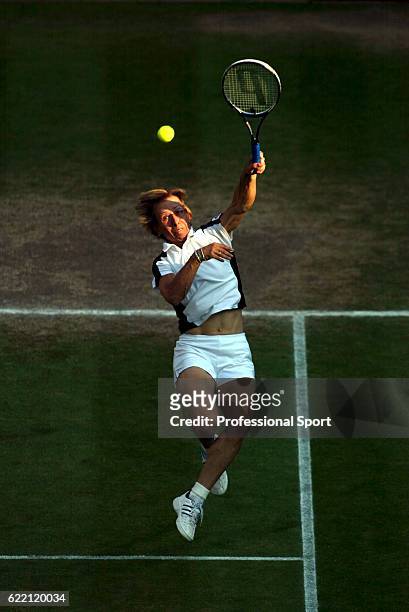 Martina Navratilova of the USA in action with her partner Leander Paes of India against Andy Ram of of Israel and Anastassia Rodionova of Russia in...
