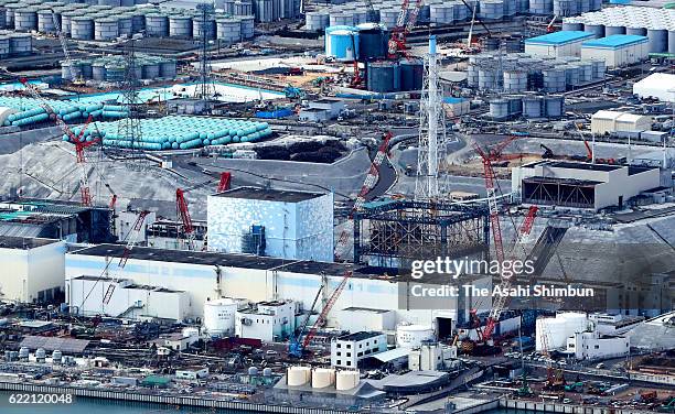 In this aerial image, the No. 1 reactor building at the crippled Fukushima Daiichi Nuclear Power Plant is completely exposed after the last of 18...