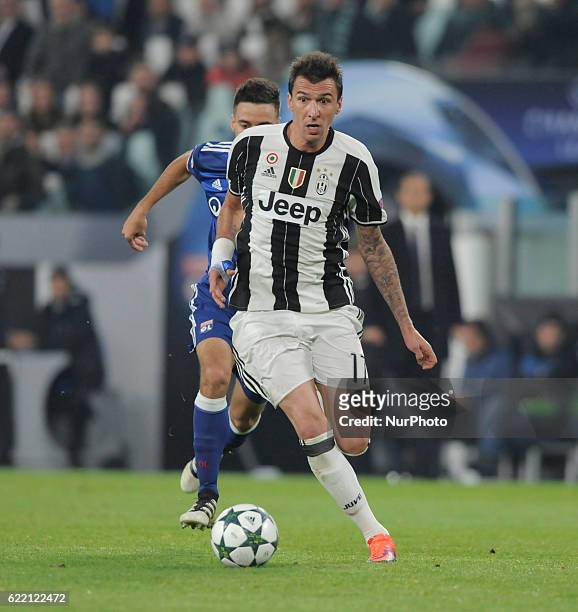 Mario Mandzukic of Juventus in action during the UEFA Champions League Group H match between Juventus and Olympique Lyonnais at Juventus Stadium on...